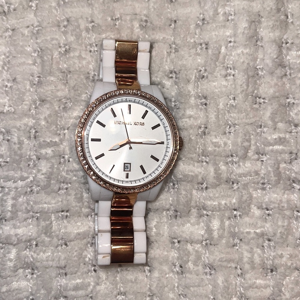 Michael Kors rose gold and white watch.